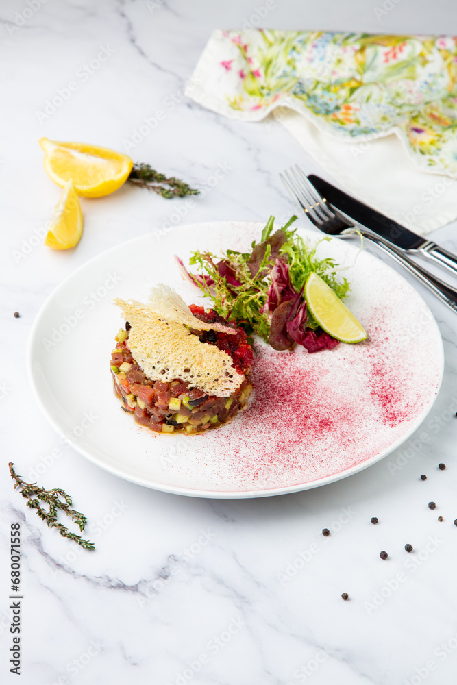 meat salad with arugula and lime, side view