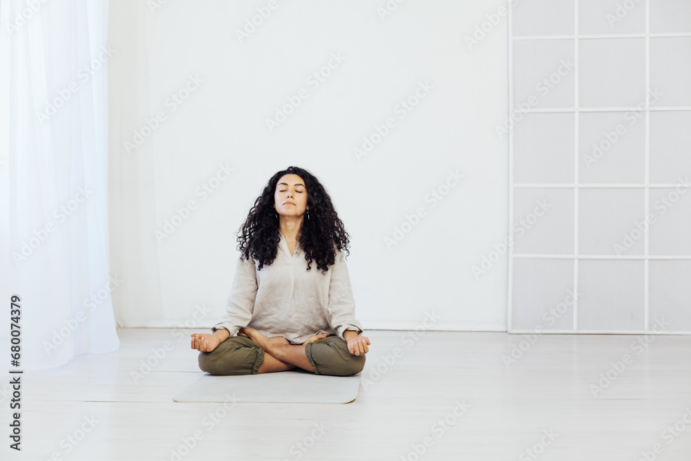 woman doing yoga lotus pose relaxation exercises woman doing yoga lotus pose relaxation exercises