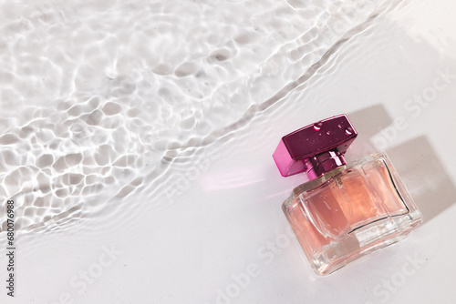 Beauty product bottle in water with copy space background on white background photo