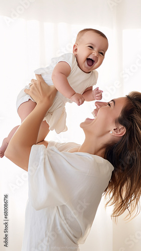 Joyful Moments Laughing Mother Lifting Her Newborn in Air with Panorama and Copy Space