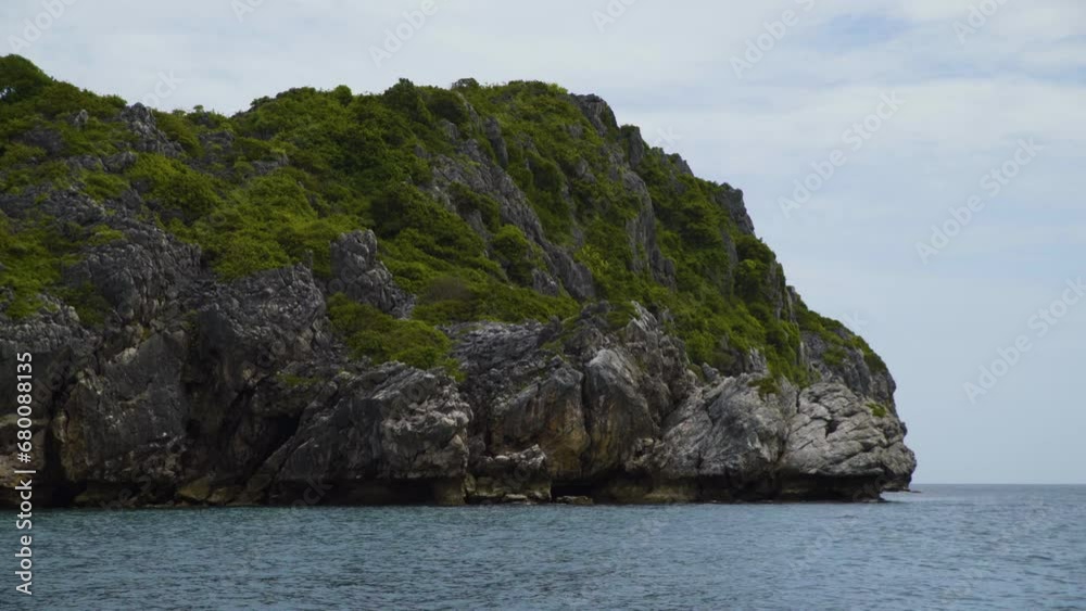 Sailing through limestone islands in Mu Ko Ang Thong National Marine Park in Koh Samui, Thailand Sailing through limestone islands in Mu Ko Ang Thong National Marine Park in Koh Samui, Thailand