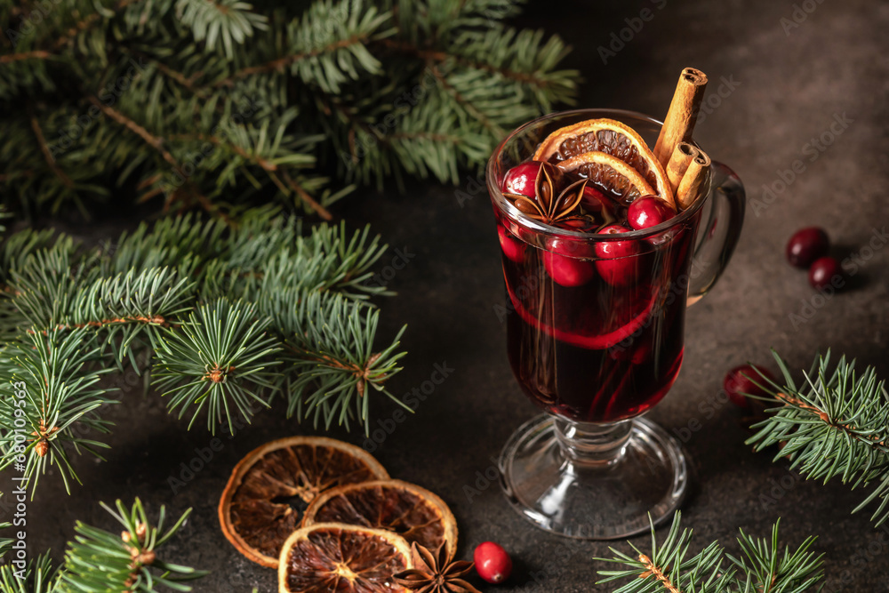 Christmas mulled red wine with spices and fruits on brown textured background. Traditional festive hot drink at Christmas time Christmas mulled red wine with spices and fruits on brown textured background. Traditional festive hot drink at Christmas time