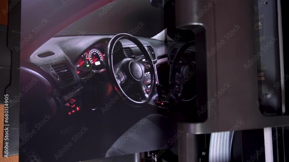 printing color photos car inside gray seats red dashboard night photography in the dark on an inkjet printer printing color photos car inside gray seats red dashboard night photography in the dark on an inkjet printer