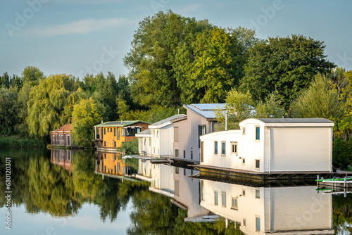 Scenery with floating houses in dutch village of Halfweg, municipality of Haarlemmermeer photo