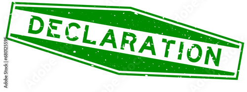 Grunge green declaration word hexagon rubber seal stamp on white background