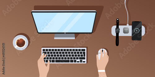 Flat vector illustration of a top view of a desktop, a girl working at a computer, a phone next to her, a watch, headphones charging on a wireless charger, a cup of coffee