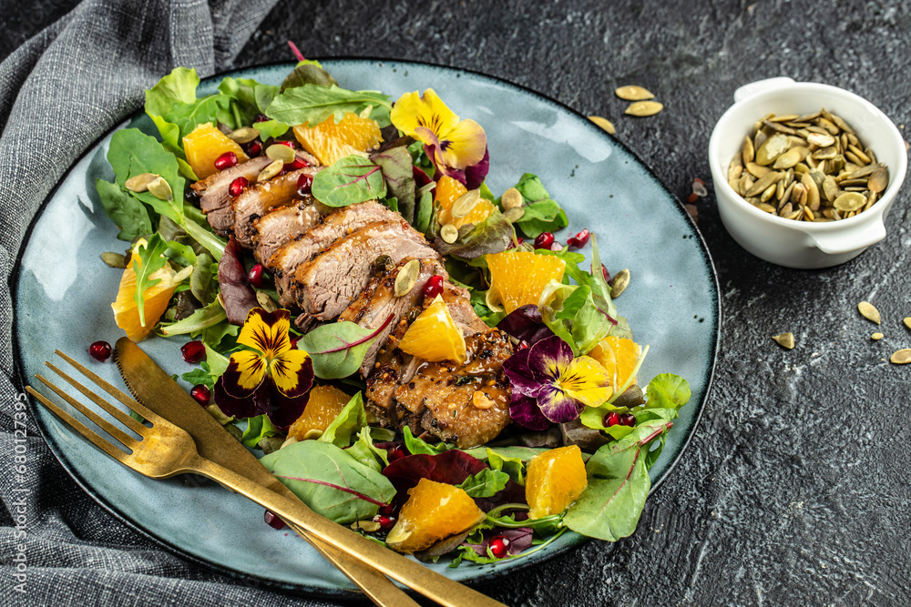 duck salad with citrus on plate. Menu, recipe mock up, banner. copy space for text. top view