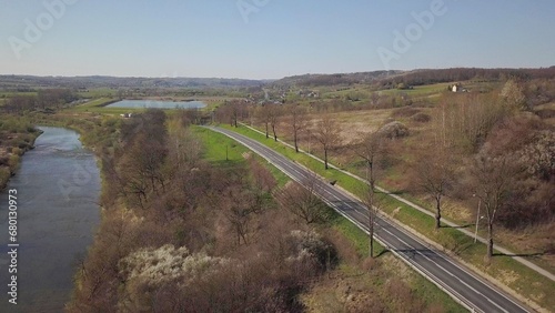 Panorama of road from a bird's eye view. Central Europe:  town or village is located among the green hills. Temperate climate. Flight drones or quadrocopter.