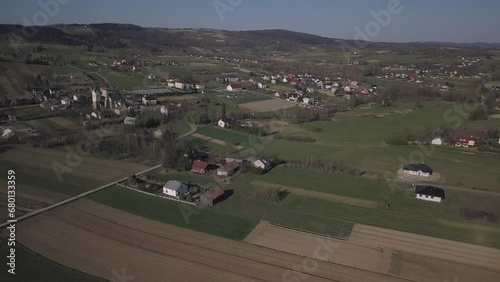 Biezdziadka, Poland - 4 9 2019: Panorama from a bird's eye view. Central Europe: The Polish village of Kolaczyce is located among the green hills. Temperate climate. Flight drones or quadrocopter. photo