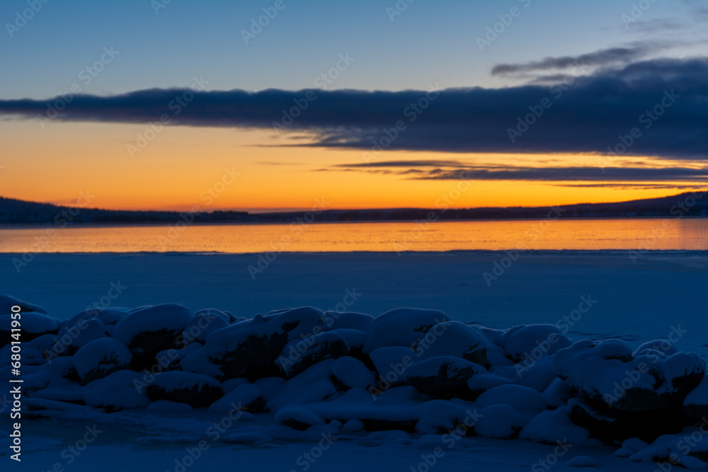 Idyllic sunset on a cold winter day at the Finnish polar circle