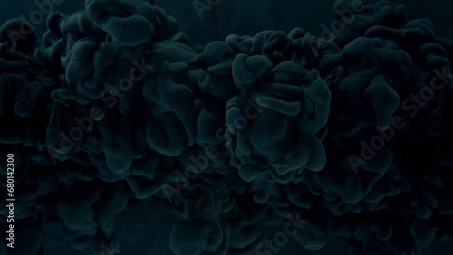 Black Paint Drops Mixing in Water.