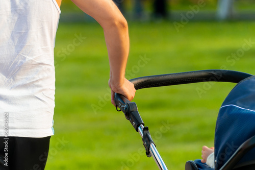 Man carries baby stroller. High quality photo