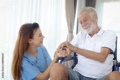 Wallpaper Mural Happy senior patient in wheelchair with beautiful female nurse taking care of him at home, disabled elderly man sits in wheelchair, woman doctor helping mature grandfather, nursing medical health care Torontodigital.ca