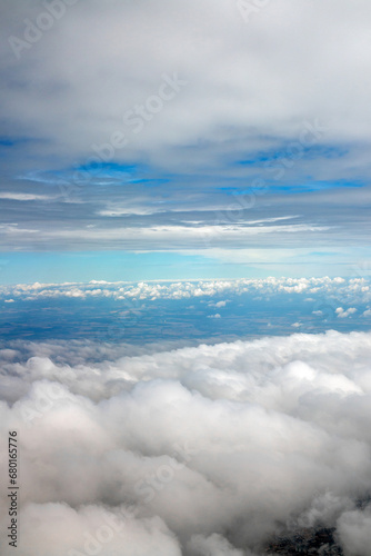 Fototapeta Naklejka Na Ścianę i Meble -  above the clouds, view above clouds from airplane window, flight, by airplane
