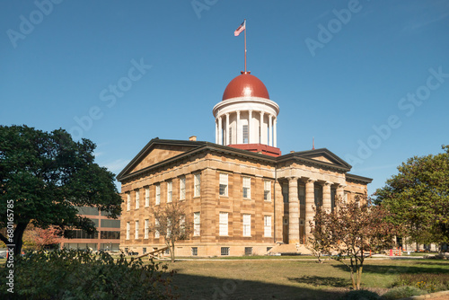 The Old Capital, Springfield, Illinois, with flag flying in breeze, full sunshine, clear blue sky 