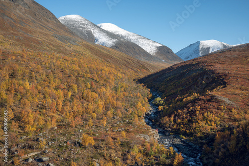 Autumn colors in the fells of Kiruna region in Swedish Lapland on a sunny day