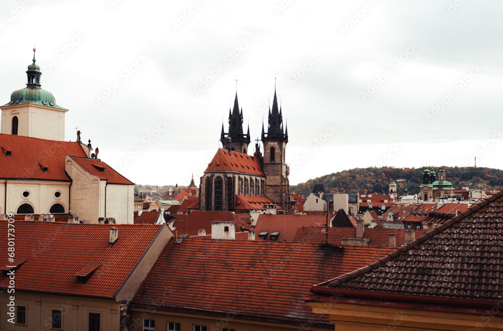 Amazing scenic view of rooftops and Church of Our Lady before Tyn in Prague, Czech Republic - autumn season. The historic center of the city Prague - view from the window of flat.