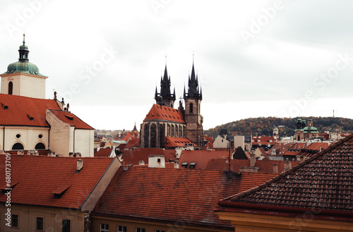 Amazing scenic view of rooftops and Church of Our Lady before Tyn in Prague, Czech Republic - autumn season. The historic center of the city Prague - view from the window of flat.