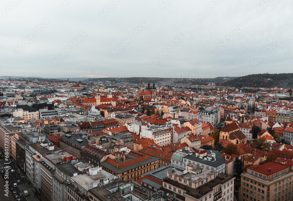 Beautiful aerial view of Prague city in Czech republic - historical part and old town in autumn time - taken by drone. Cityscape of Prague from above at evening - dark moody weather.