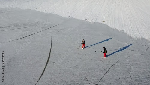 Playing hockey in a field on ice