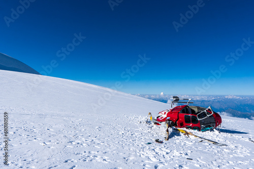 broken helicopter in the mountains on the snow in the Swiss Alps, Monte Rosa or Dufourspitze the highest mountain in Switzerland.