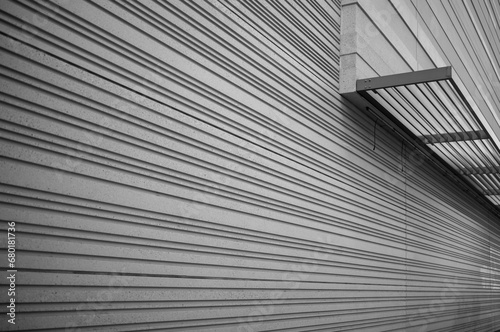 Abstract Sideview of a Corrugated Building Wallin Black and White.