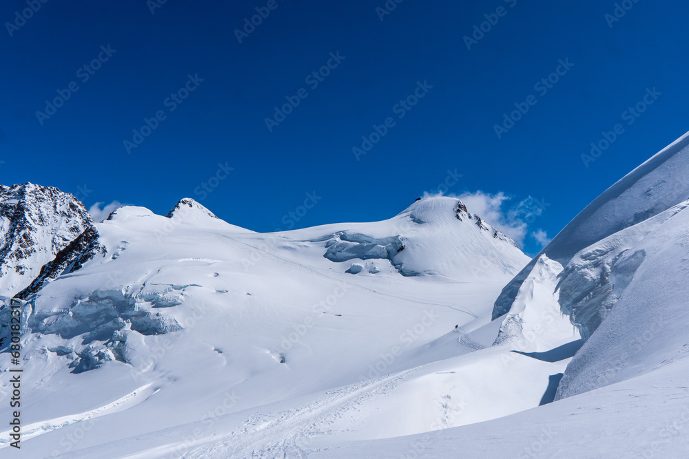 Winter snow covered mountain peaks in Europe. Great place for winter sports. Monte rosa massiv or Dufourspitze in Swiss Alps. The Spaghetti Tour is a traverse of the Monte Rosa massif.