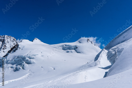 Winter snow covered mountain peaks in Europe. Great place for winter sports. Monte rosa massiv or Dufourspitze in Swiss Alps. The Spaghetti Tour is a traverse of the Monte Rosa massif. © Martin