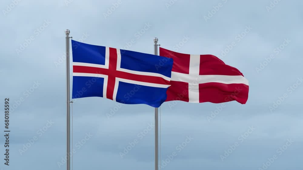 Denmark flag and Iceland flag waving together on cloudy sky, endless seamless loop, two country relations concept Denmark flag and Iceland flag waving together on cloudy sky, endless seamless loop, two country relations concept