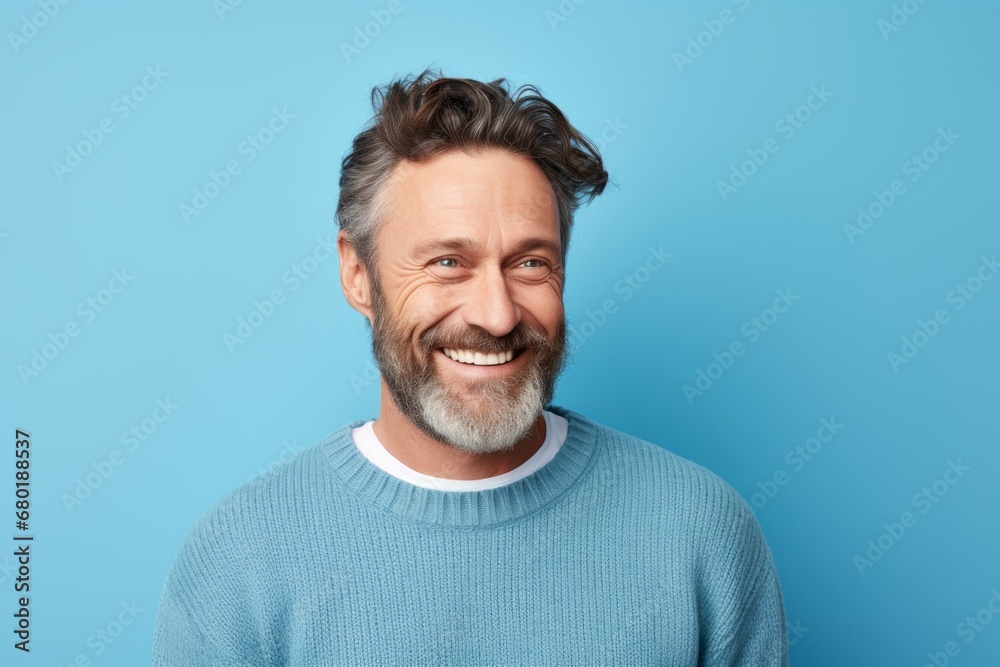 Portrait of a happy man in his 40s dressed in a warm wool sweater against a pastel blue background. AI Generation Portrait of a happy man in his 40s dressed in a warm wool sweater against a pastel blue background. AI Generation
