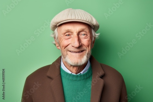 Portrait of a blissful man in his 80s dressed in a warm ski hat against a pastel green background. AI Generation