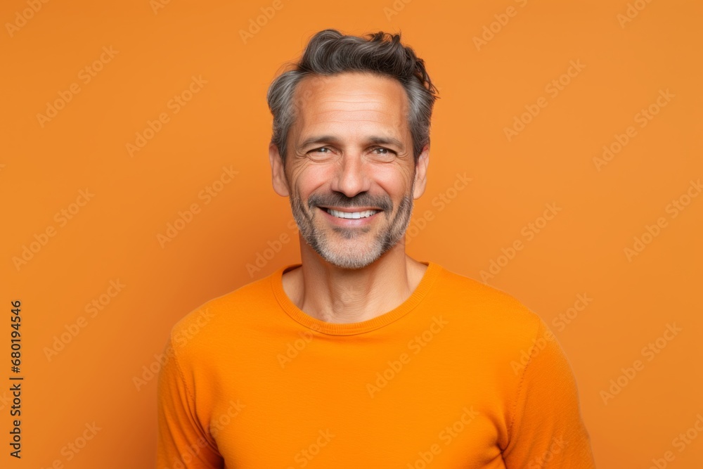 Portrait of a smiling man in his 40s donning a trendy cropped top against a soft orange background. AI Generation Portrait of a smiling man in his 40s donning a trendy cropped top against a soft orange background. AI Generation