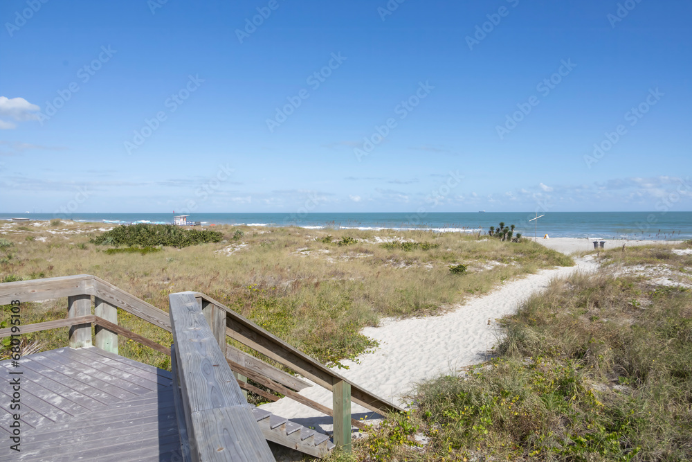 Fototapeta premium A pathway leads towards the Atlantic Ocean at Lori Wilson Park (Cocoa Beach), Florida.