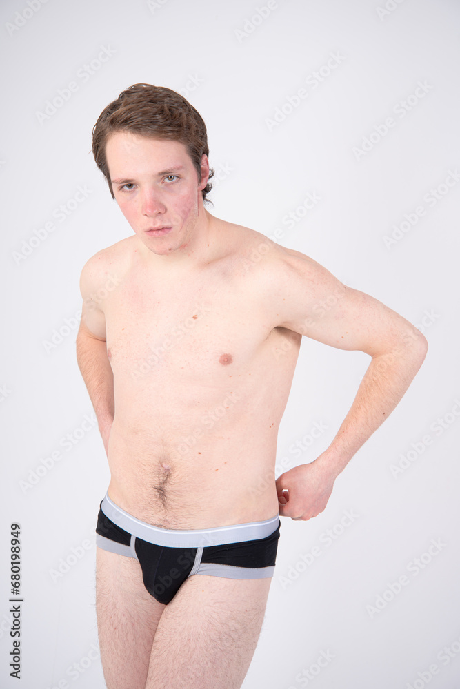 Young attractive man posing in the studio. Young attractive man posing in the studio.