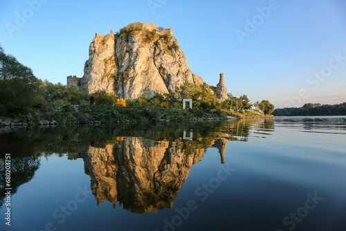 Devin castle ruin in Bratislava reflecting in river March at Danube confluence