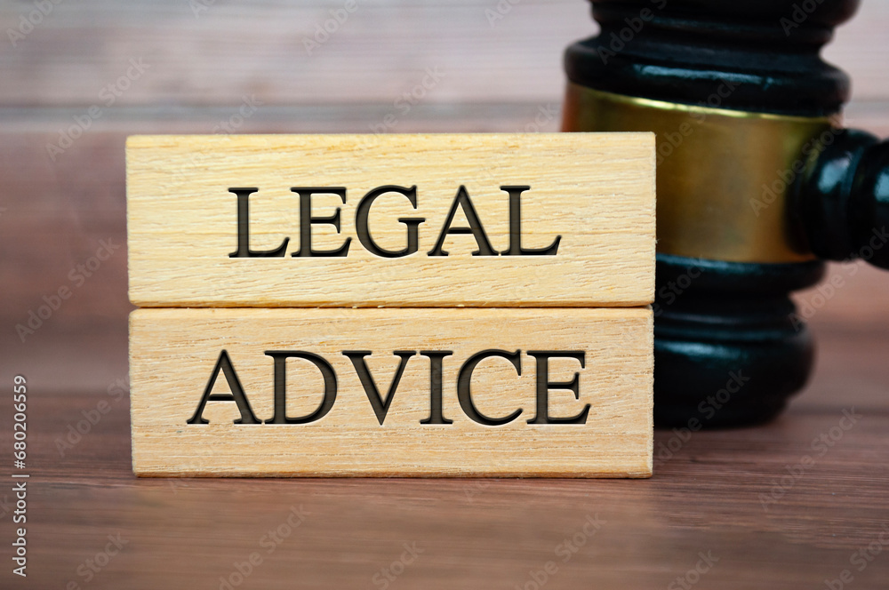 Legal Advice text on wooden blocks with gavel background. Legal Advice concept Legal Advice text on wooden blocks with gavel background. Legal Advice concept