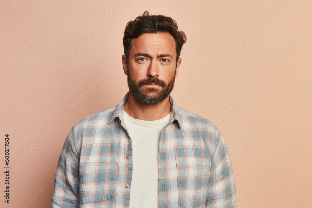 Portrait of a tender man in his 30s wearing a comfy flannel shirt against a pastel or soft colors background. AI Generation Portrait of a tender man in his 30s wearing a comfy flannel shirt against a pastel or soft colors background. AI Generation