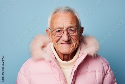 Portrait of a blissful man in his 80s wearing a warm parka against a pastel or soft colors background. AI Generation