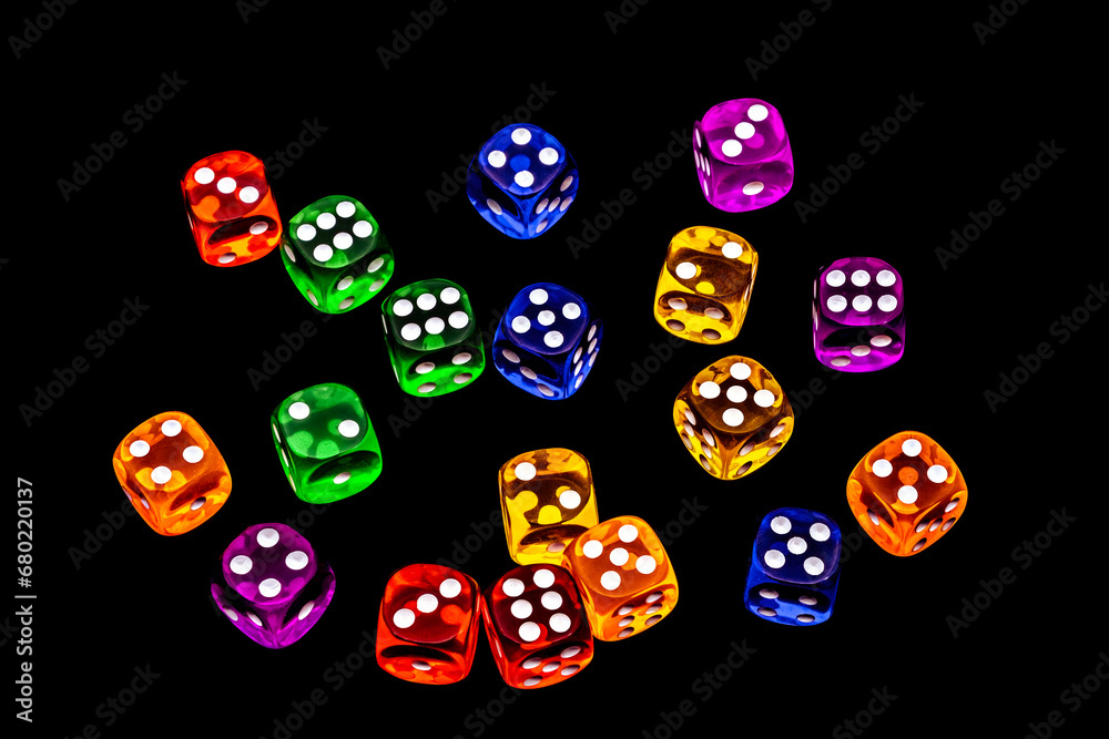 transparent colored dices on dark surface transparent colored dices on dark surface