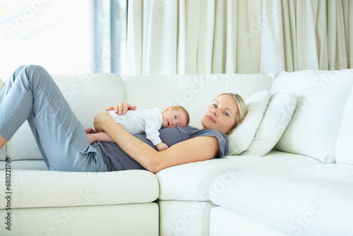 Relax, home and sofa, mother and baby bonding, woman and kid lying in living room together. Calm morning, mom and newborn on couch for rest, love and family security, comfort and child care in lounge