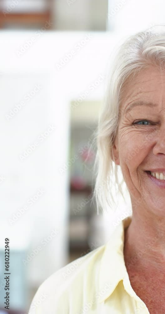 Half face of happy caucasian senior woman standing and laughing in sunny room, slow motion Half face of happy caucasian senior woman standing and laughing in sunny room, slow motion