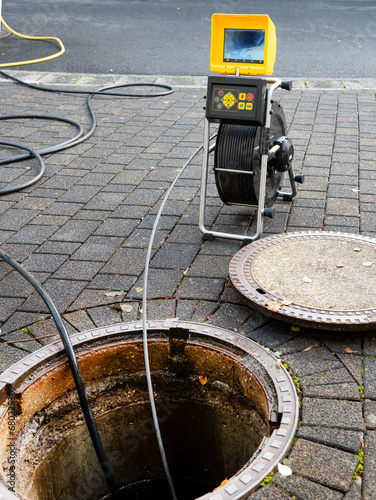 A drain cleaning company checks a blocked drain with a camera before flushing it out photo