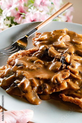 Fototapeta Naklejka Na Ścianę i Meble -  Sauerkraut pancakes /fuczka/ with mushroom sauce .
