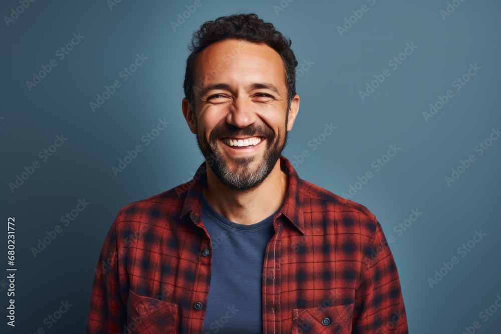 Portrait of a happy man in his 40s dressed in a relaxed flannel shirt against a blank studio backdrop. AI Generation Portrait of a happy man in his 40s dressed in a relaxed flannel shirt against a blank studio backdrop. AI Generation