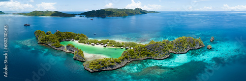 Idyllic Rufas Island, near Penemu in Raja Ampat, is surrounded by healthy corals and open ocean. This island, as well as those in the region, support some of the highest marine biodiversity on Earth. photo