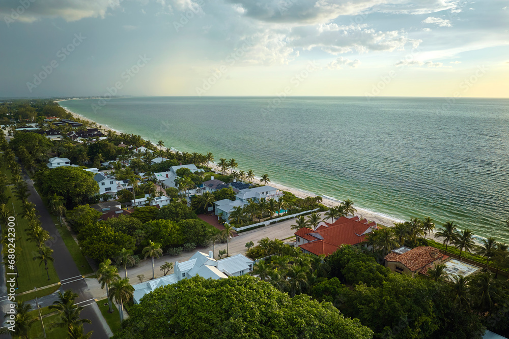 View from above of large residential houses in island small town Boca