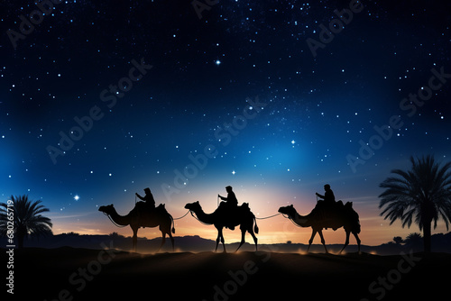 Silhouette of the three wise men traveling on camels to Bethlehem for the birth of baby Jesus