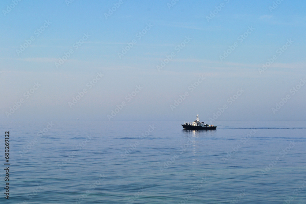Baltiysk, Kaliningrad region, Baltic spit, ship in the Baltic Sea, water surface to the horizon Baltiysk, Kaliningrad region, Baltic spit, ship in the Baltic Sea, water surface to the horizon