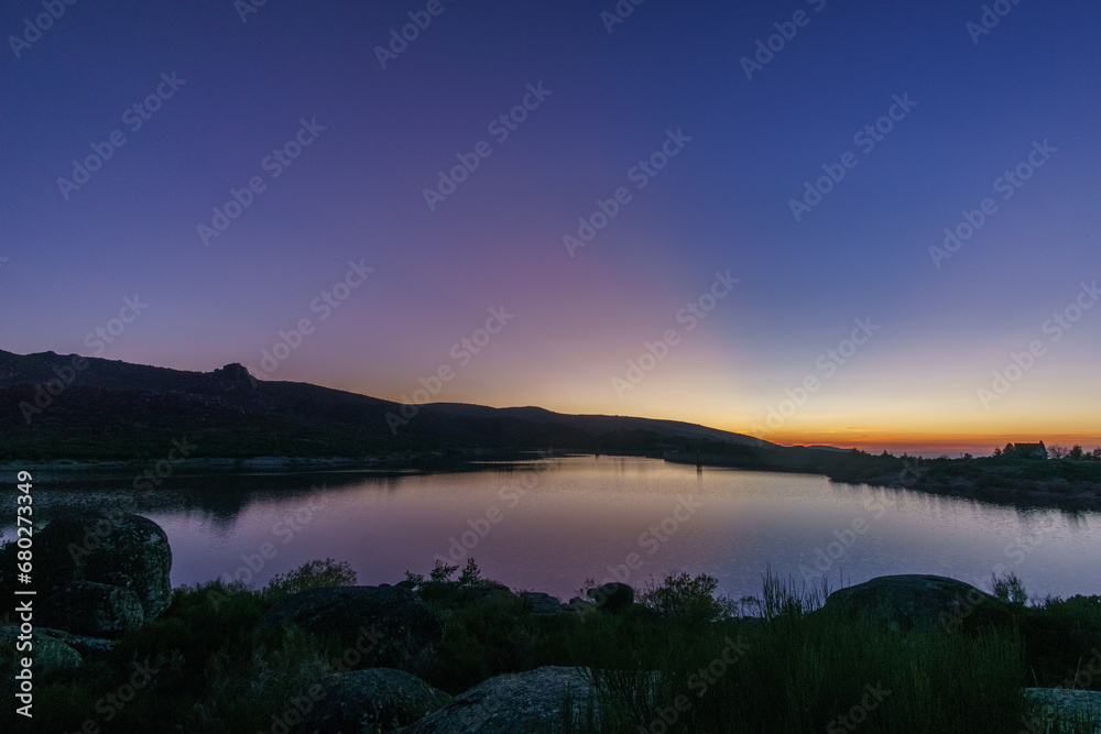 Colorful evening twilight beautiful over mountain lake after sunset in rocky pure landscape, Vale do Rossim, Serra da Estrela, Portugal