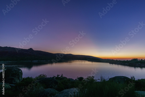 Colorful evening twilight beautiful over mountain lake after sunset in rocky pure landscape, Vale do Rossim, Serra da Estrela, Portugal © Sebastian